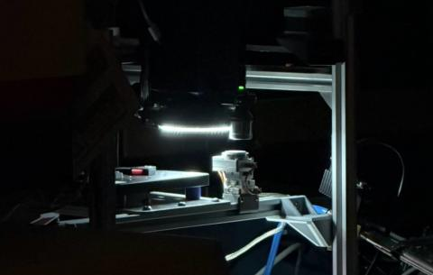 The assembled profilometry system on the optical bench, lit from within